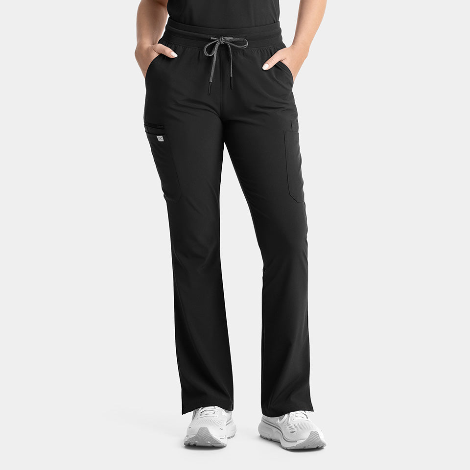 Person wearing black drawstring pants on a white background